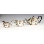 A silver tea service, Josiah Williams and Co, London 1900-1901, comprising teapot, milk jug and