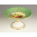 A Mintons fruit painted comport, the well enamelled with fruit and signed by Joseph Colclough,