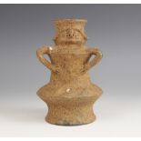 A South American zoomorphic pottery vessel, probably Columbian, of compressed globe and shaft form