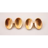 A pair of yellow metal cufflinks, each link of oval concave plain polished form, 17mm long, with