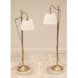 Christopher Wray, London, a pair of lacquered brass floor standing reading lamps, late 20th century,