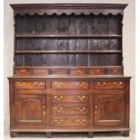 A George III oak Conwy Valley high back dresser, mid 18th century, the moulded dentil cornice over a