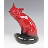 A Royal Doulton Flambe fox of large proportions, modelled seated and looking skywards, 24cm high