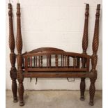 A 19th century mahogany part tester bed, comprising head and foot board, each with an arched