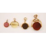 A selection of four 9ct yellow gold mounted swivel fobs, to include an Edwardian bloodstone and