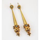 A pair of late 19th century yellow metal earrings, the turquoise coloured cabochon within an