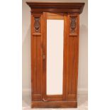 An Art Nouveau mahogany bachelor's single wardrobe, Timberlins Ltd, the single mirror door flanked