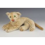 A Steiff lion cub, mid 20th century, with green glass eyes, pink stitched nose and silver coloured