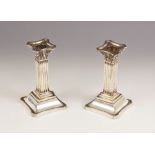 A pair of Victorian silver Corinthian column candlesticks, Martin, Hall & Co, Sheffield 1898, each