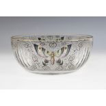 A hand enamelled cut glass fruit bowl, 20th century, decorated with butterflies among scrolls and