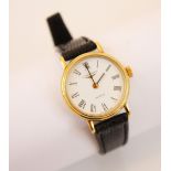 A gold-plated ladies Longines quartz wristwatch, the circular white dial with Roman numerals, set to
