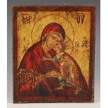 A religious icon in the Russian manner depicting the Madonna And Child, 20th century, canvas laid on