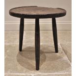 A Welsh elm vernacular cricket/candle table, 16th/17th century, the circular slab top with a moulded