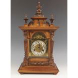 A walnut cased German eight day mantel clock by H.A.C ( Hamburg America Clock Co), late 19th