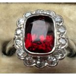 A early 20th century certified Burmese red spinel and diamond cluster ring, the central rub over set