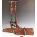 A Victorian mahogany boot jack, late 19th century, of typical form with bobbin turned details,