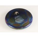 A John Ditchfield for Glasform iridescent paperweight, of squat circular form with applied cast