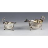 A George V silver sauce boat, Adie Brothers Ltd, Birmingham 1925, with scroll handle upon three