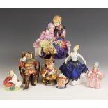 A selection of Royal Doulton figures, to include; The Flower Seller's Children HN1206, printed and