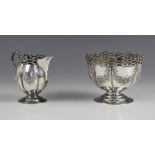 An Edwardian silver cream jug and sugar bowl, Mappin and Webb Ltd, London 1902, each with openwork