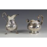A George IV silver cream jug, J E Terrey and Co, London 1820, the gadrooned rim above an acanthus