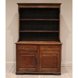 A George III oak country dresser, the rectangular base with two frieze drawers above two panelled