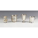 A Victorian silver twin handled presentation cup, Martin Hall and Co, London 1880, with loop handles