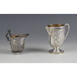 A Victorian silver cream jug, Marshall and Sons, Edinburgh 1886, the crimped rim above embossed