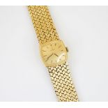 An 18ct gold Omega lady’s wristwatch, the square champagne colour dial with baton markers, set to