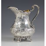 A Victorian silver milk jug, possibly John Wellby, London 1841, the cast foliate rim above an