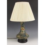 A Moorcroft table lamp in the "Peacock" pattern designed by Rachel Bishop, on turned wooden base,