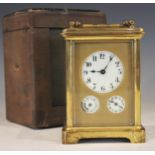 A French brass cased carriage clock, late 19th century, the 4cm ceramic dial applied with Arabic