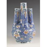 A French faience five neck bulb vase of large proportions, 20th century, decorated with climbing