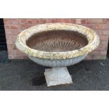 A Victorian cast iron garden urn, of lobed bowl form, with a scalloped rim, 61cm H x 101cm D