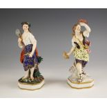 Two Crown Debry figures of maidens early 19th century, one modelled with a net and her catch of