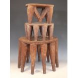 Two Nigerian Nupe Tribe stools, each circular shaped top with carved geometric detailing, and raised