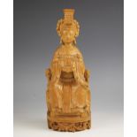 A Chinese boxwood carving of a female deity, 19th/20th century, modelled seated upon a chair wearing