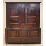 A late 18th century oak jointed livery cupboard, probably Welsh, the moulded cornice above a