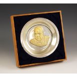 A silver coloured ‘The Churchill centenary trust plate 1974’ the circular plate with gilt