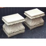 A pair of reconstituted stone plinths, of ogee form, moulded in relief with shell and acanthus