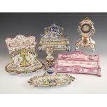 A collection of French faience, 20th century, comprising: a desk stand modelled as a settee, 10cm