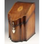 A George III mahogany and rosewood crossbanded cutlery box, of serpentine form, the hinged top