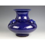 A Chinese porcelain powder blue glazed vase, the squat form baluster vase with an all-over blue