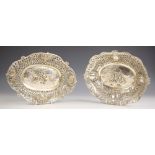 A Continental silver coloured dish, the pierced foliate border with four floral embossed basket