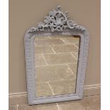 A giltwood and gesso wall mirror, 19th century, later re-painted, with an openwork scrolling foliate