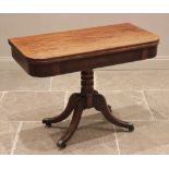 A George IV mahogany pedestal tea table, the rectangular hinged top with rounded front corners, upon