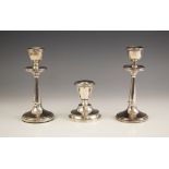 A pair of George V silver candlesticks, possibly H J Cooper and Co Ltd, Birmingham 1919, of plain