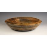 A sycamore bowl of shallow form, late 19th century, with incised key line and banded detail, 41cm