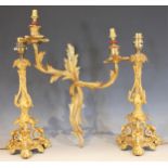 A pair of French gilt metal Rococo style desk lamps, early 20th century, each formed with