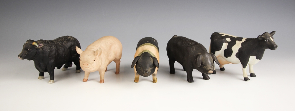 Five porcelain farmyard animals, each naturalistically modelled, comprising: three pigs, 9cm high,